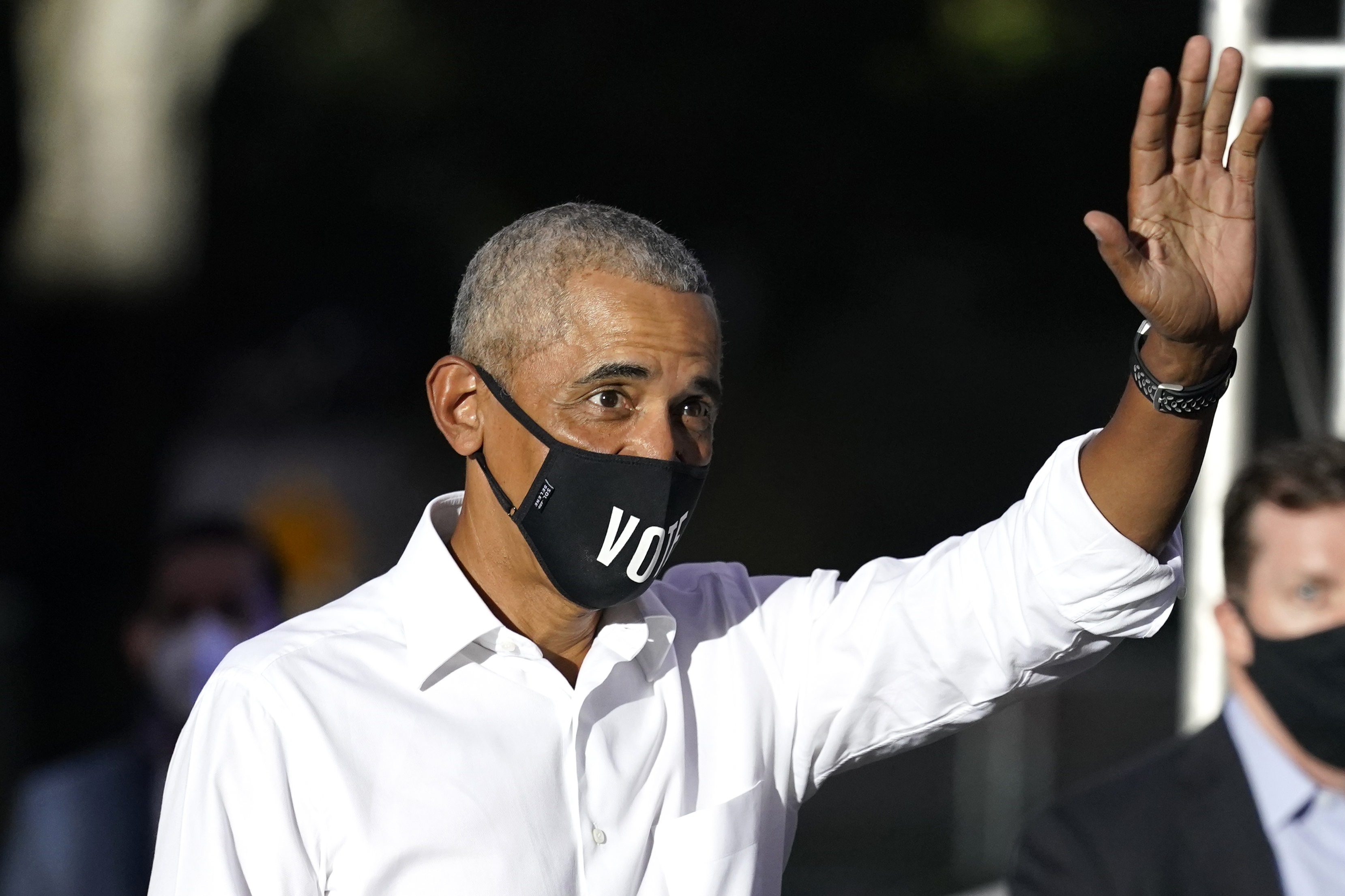 Former President Barack Obama waves as he arrives for a campaign rally for Democratic presidential candidate former Vice President Joe Biden, Monday, Nov. 2, 2020, in Miami. (AP Photo/Lynne Sladky)